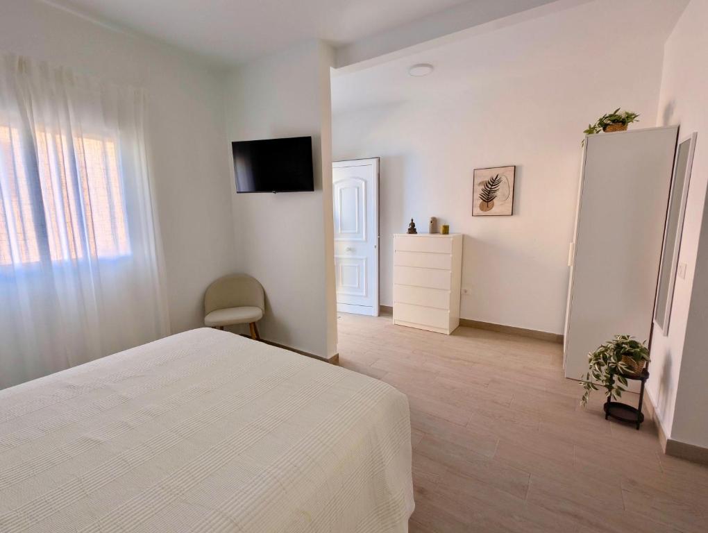 TV a/nebo společenská místnost v ubytování Acapulco Apartamento cerca de Santa Cruz y del mar