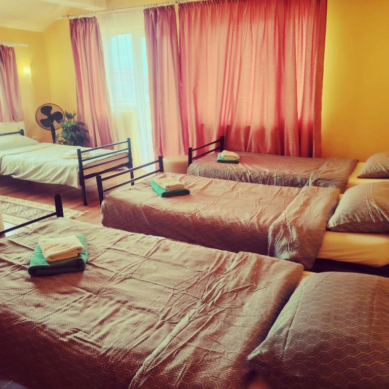 Ένα ή περισσότερα κρεβάτια σε δωμάτιο στο Family or Friends Room