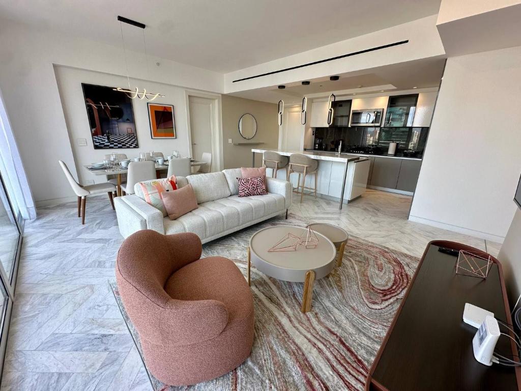 a living room with a couch and a table at Luxury apt in Panama City 2 Rooms 3 Baths office in Panama City