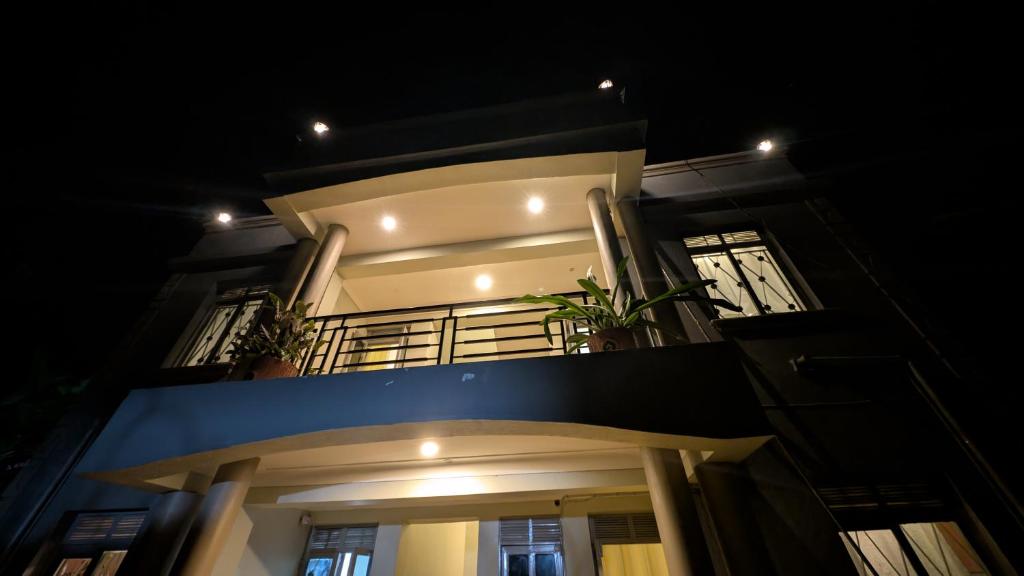 a night view of a house with lights on it at BougainVille in Fort Portal