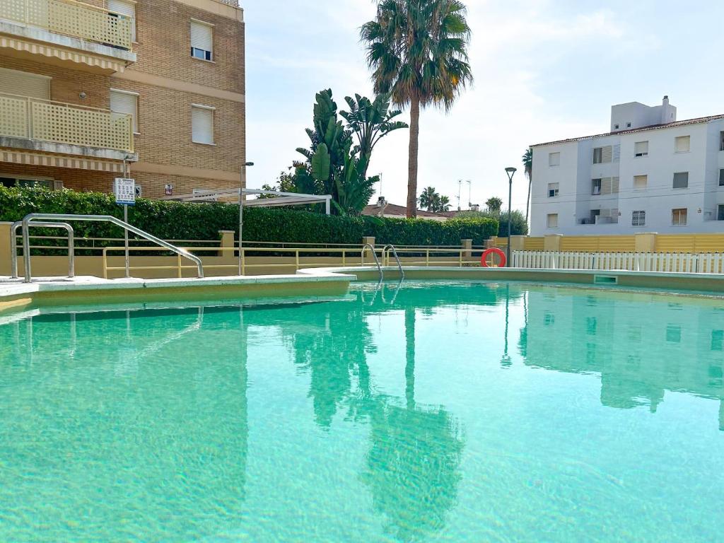 a large pool of water in front of a building at Apartment Sunset in Cunit