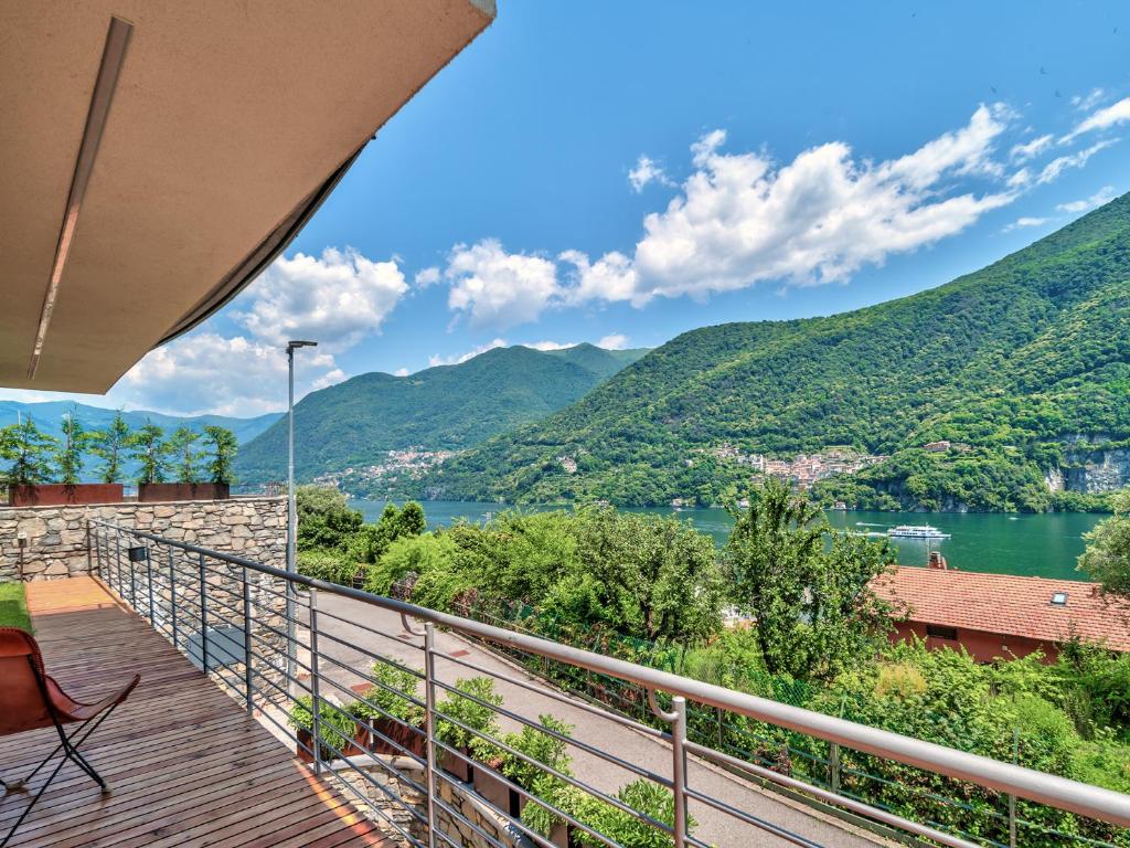 a balcony with a view of a river and mountains at Relax, silence, romantic, amazing view in Laglio