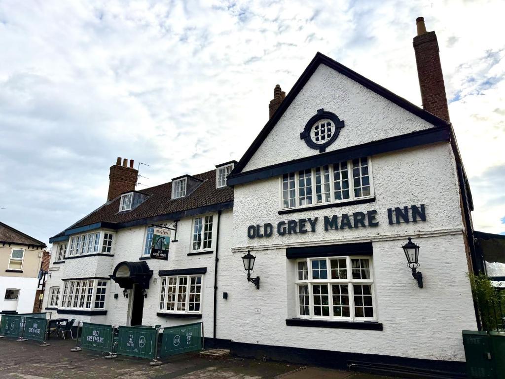an old grey mire inn with a sign on it at Old Grey Mare in York