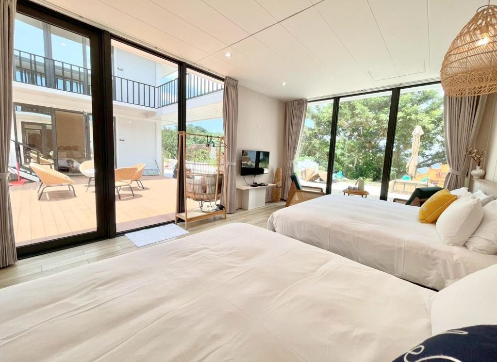 Ένα ή περισσότερα κρεβάτια σε δωμάτιο στο WangWangSea Villa