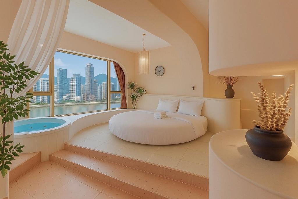 a bedroom with a bed and a tub and a window at Chongqing City Center River View B&B in Chongqing