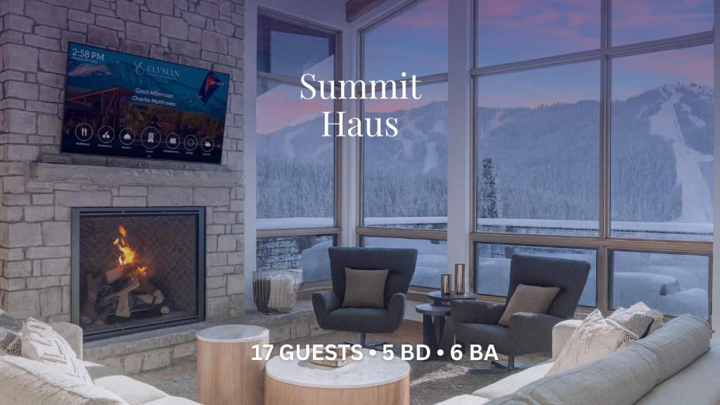 a living room with a fireplace and a tv at Summit Haus in Winter Park