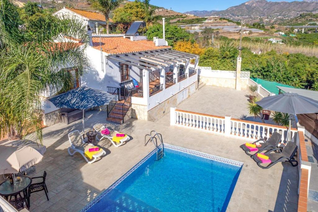 an aerial view of a house with a swimming pool at Villa Elisa in Nerja