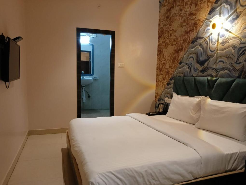 Postel nebo postele na pokoji v ubytování Hotel Zion Inn, Cantonment, Varanasi