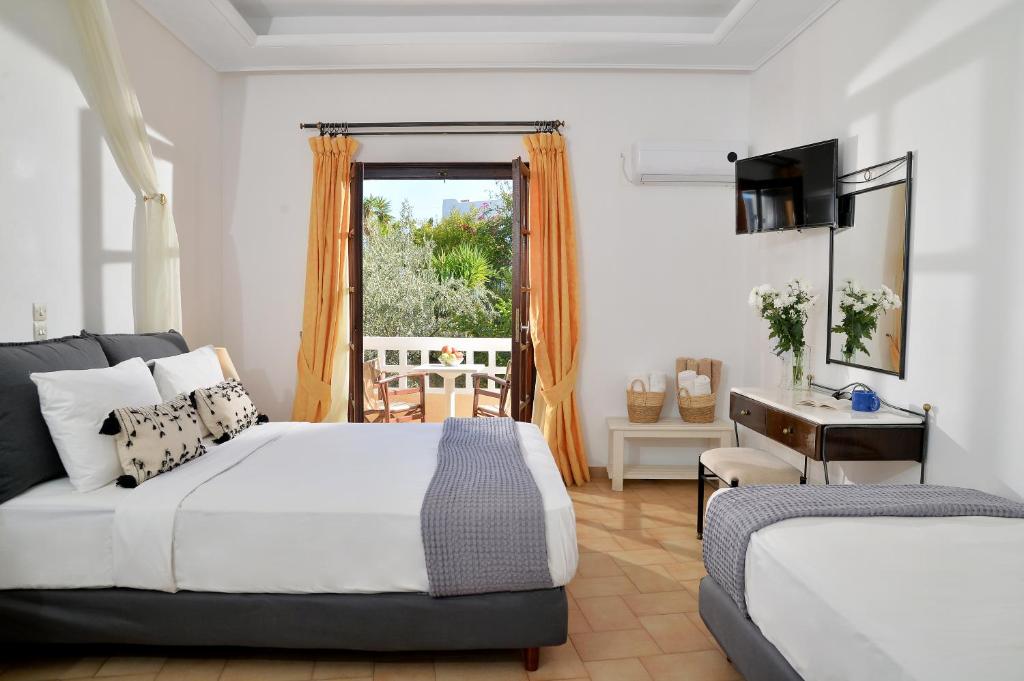 Postel nebo postele na pokoji v ubytování Vasilaras Hotel
