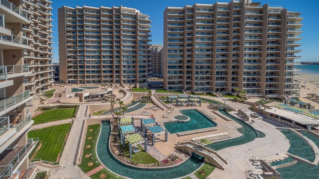 an aerial view of a resort with two tall buildings at Rubi 805 1 BR 1BA Condo Phase 1 @ Las Palomas in Puerto Peñasco