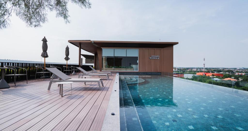 a pool on the roof of a building at The one ratchaphruek in Ban Nong Bua