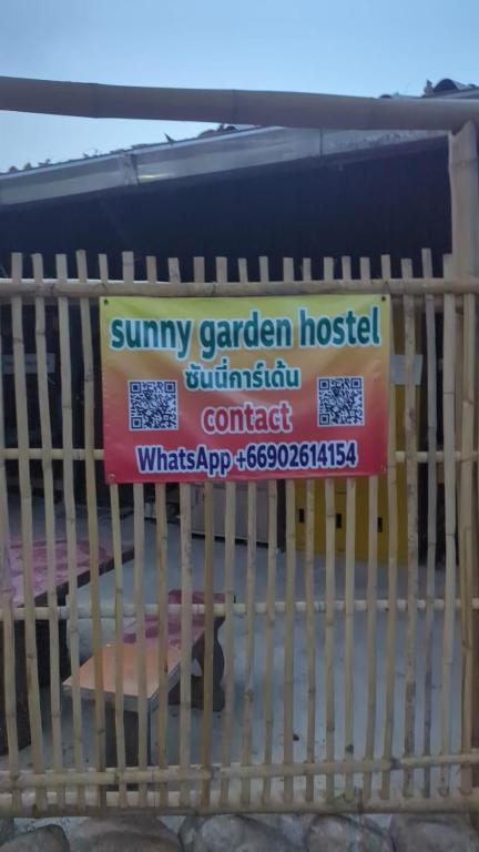 a sign for a mattress on a rack at Sunny hostel garden in Pai