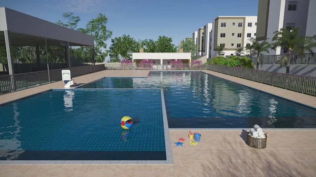 a large swimming pool with a toy in the water at Ap 2 Quartos 5km da BR, Palhoça in Palhoça