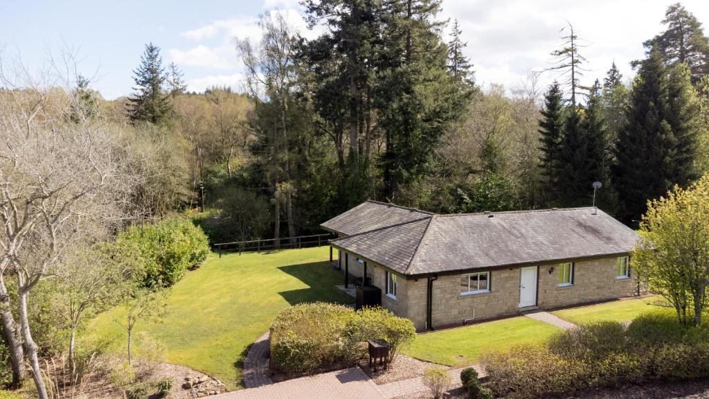 an aerial view of a house with a yard at Landal Hexham Lodges in Slaley