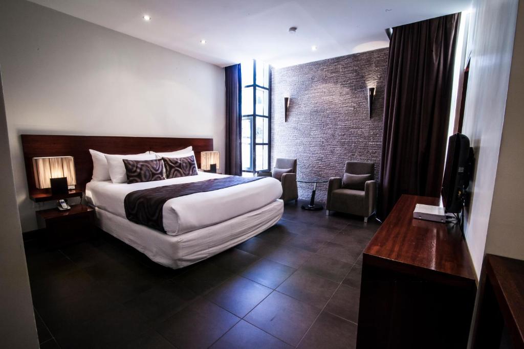 Postel nebo postele na pokoji v ubytování Lamana Hotel