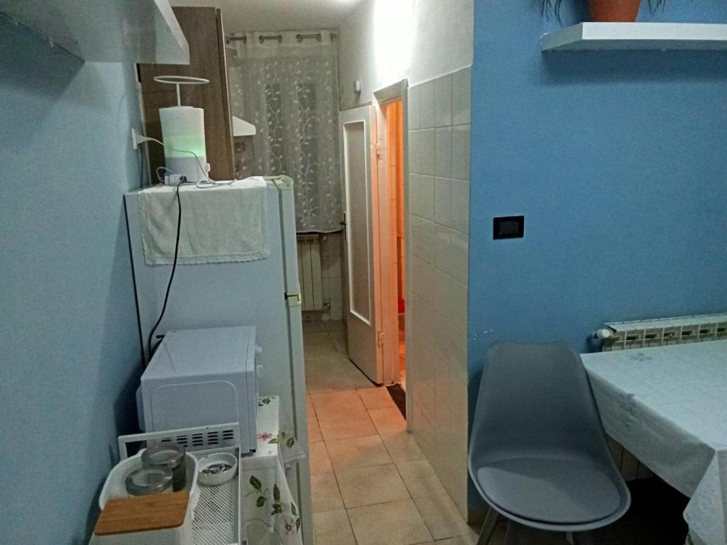 a bathroom with a sink and a washing machine at Brin house in Genova