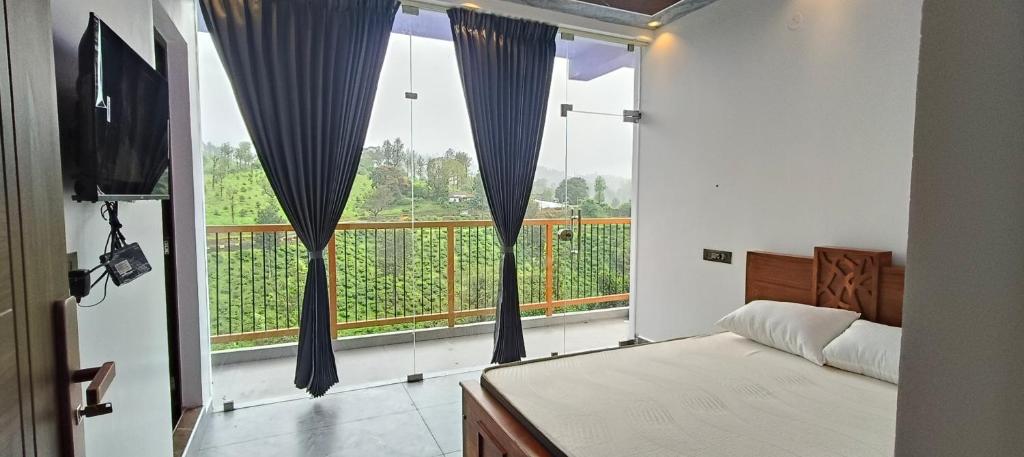 Ένα ή περισσότερα κρεβάτια σε δωμάτιο στο kavi luxury home stay