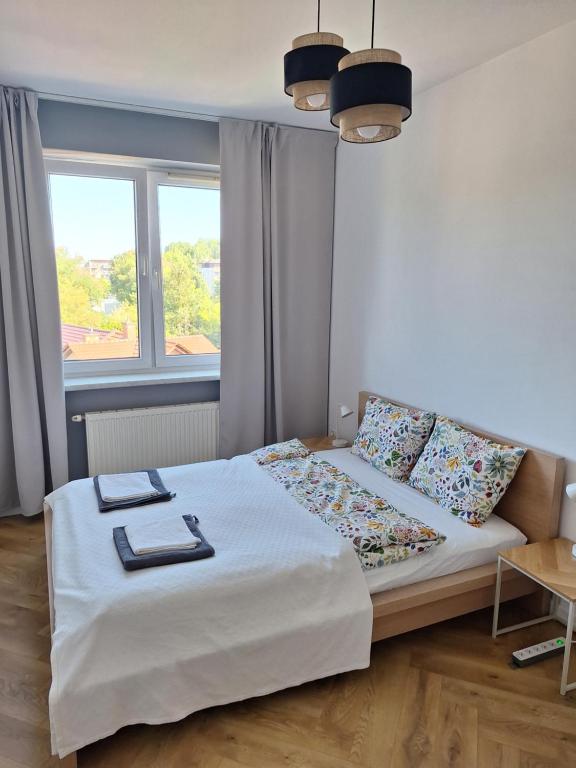 Postel nebo postele na pokoji v ubytování Kraków 2 Room Apartment Near Tauron Arena EXPO