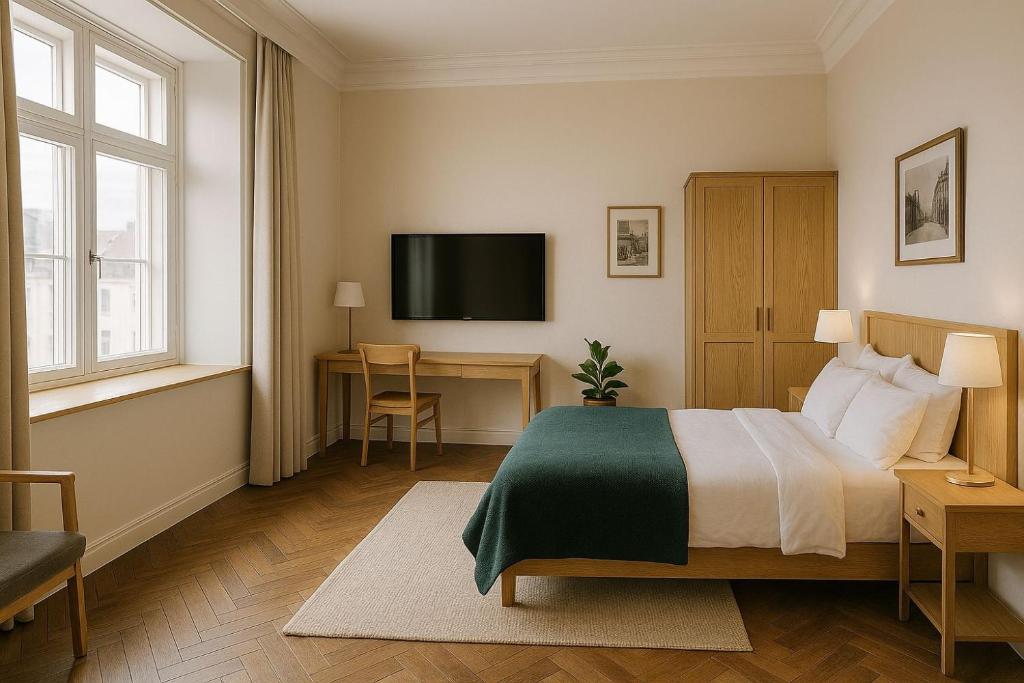 a bedroom with a bed and a desk and a television at Aloen Weresos in Cunnamulla