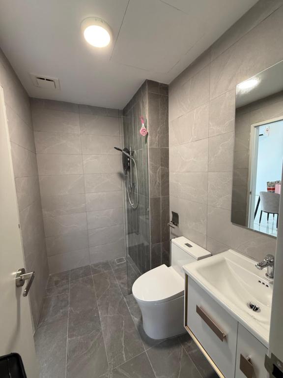 a bathroom with a toilet and a sink and a shower at Majestic Residence KLCC By AFA in Kuala Lumpur