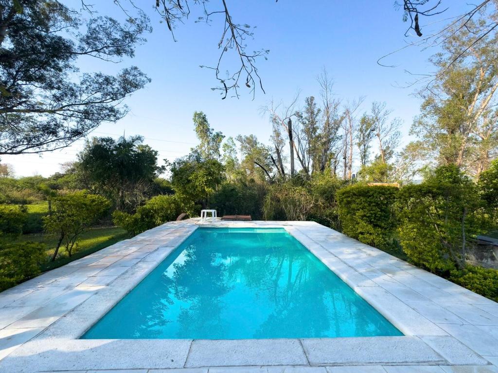 Photo de la galerie de l'établissement Casa de Verano en Ypacaraí con lago natural, Piscina, Naturaleza y Comodidad para Grupos, à Ypacarai