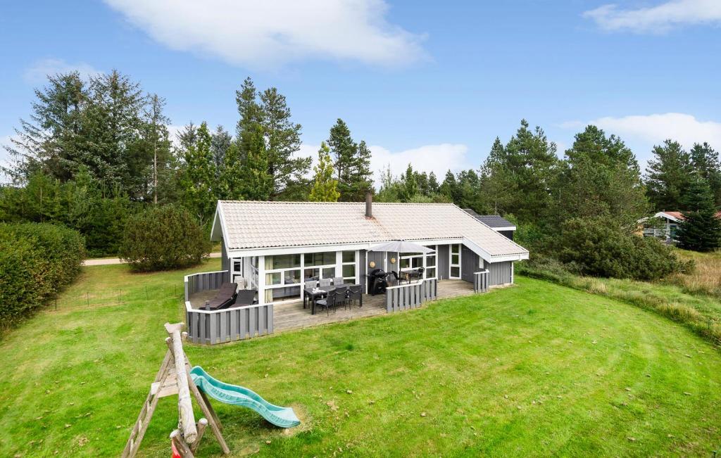 a home with a large yard with a house at Lovely Home In Nørre Nebel With Sauna in Lønne Hede