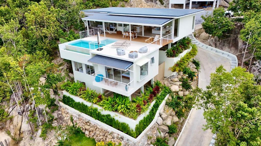 an aerial view of a house with a swimming pool at Horizon Villa in Srithanu
