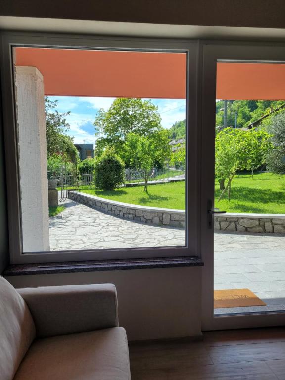 an open window with a view of a patio at Casa Paolina in Premeno