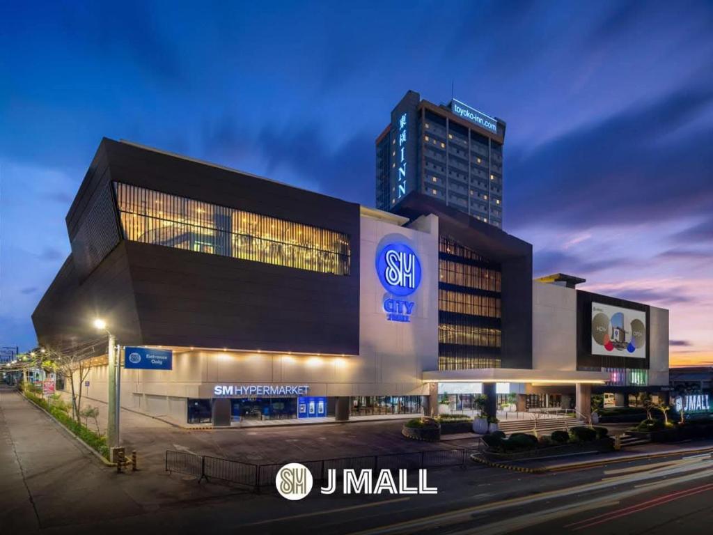 a large building with a samsung sign in front of it at Jtower residences in Mandaue City