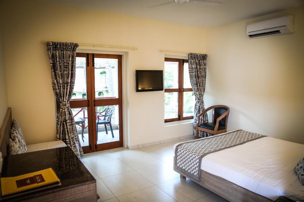 Кровать или кровати в номере Nanu Beach Resort & Spa