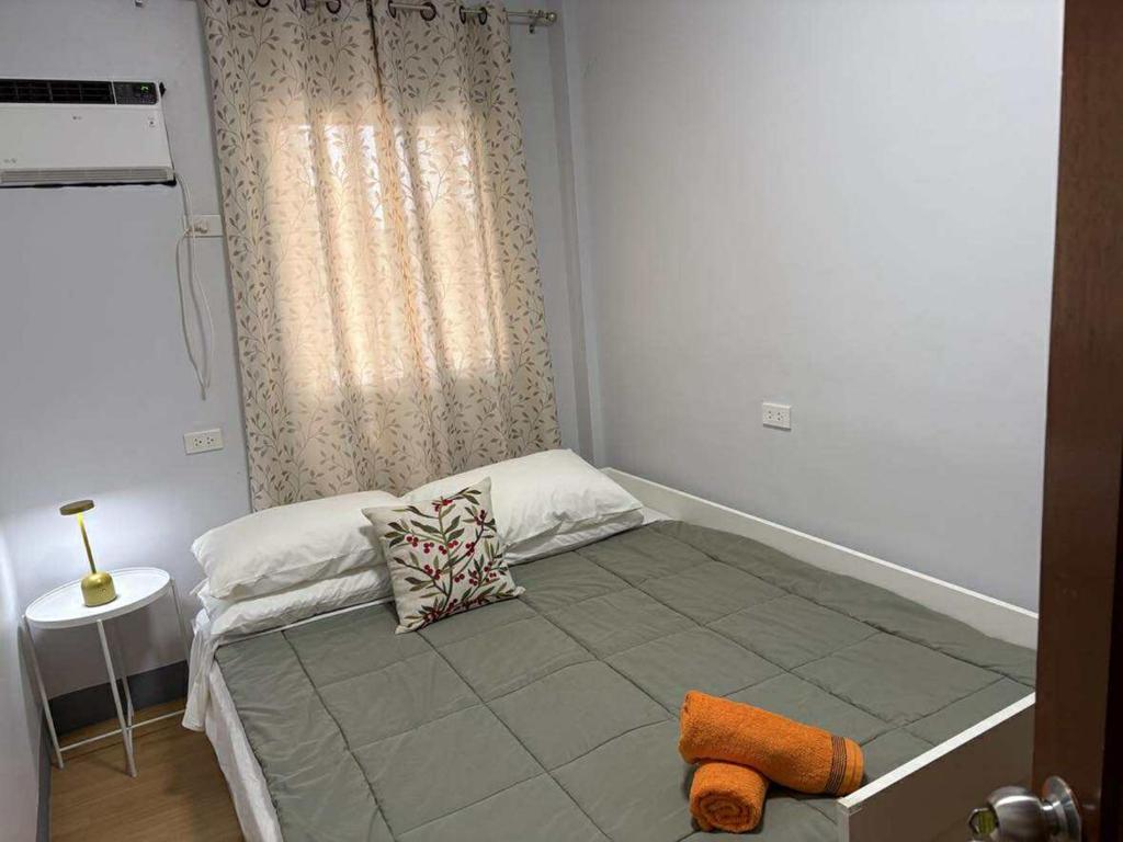 Ένα ή περισσότερα κρεβάτια σε δωμάτιο στο Molave Terraces