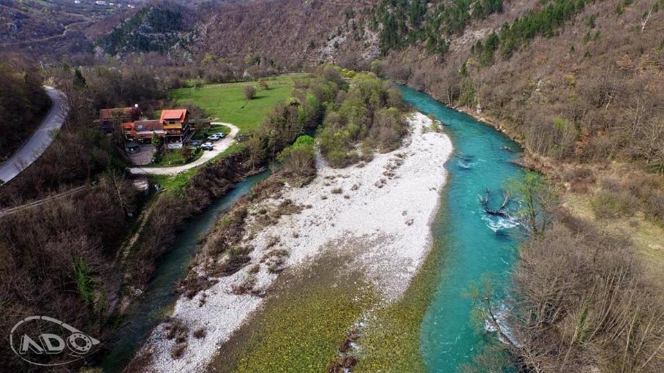 an aerial view of a river with a house next to it at Holiday Park Tajoraft in Konjic