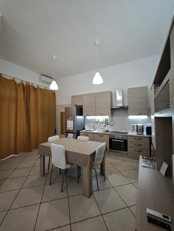 a kitchen with a table and chairs in a room at Domenico 's in Ruvo di Puglia