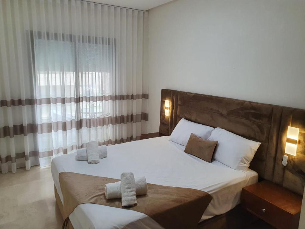 Ένα ή περισσότερα κρεβάτια σε δωμάτιο στο Borj rayhan 2