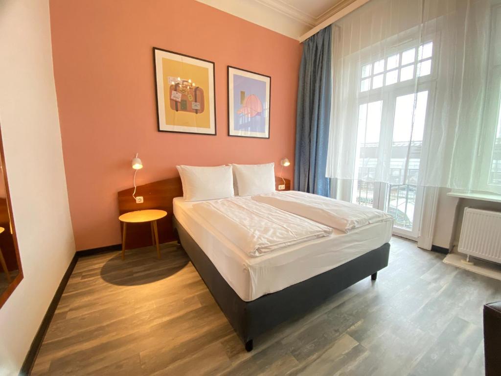 Ένα ή περισσότερα κρεβάτια σε δωμάτιο στο Garner Hotel Hamburg - St Georg by IHG