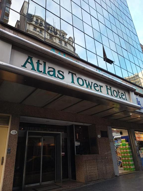 a atlas tower hotel sign in front of a building at ATLAS TOWER HOTEL in Buenos Aires