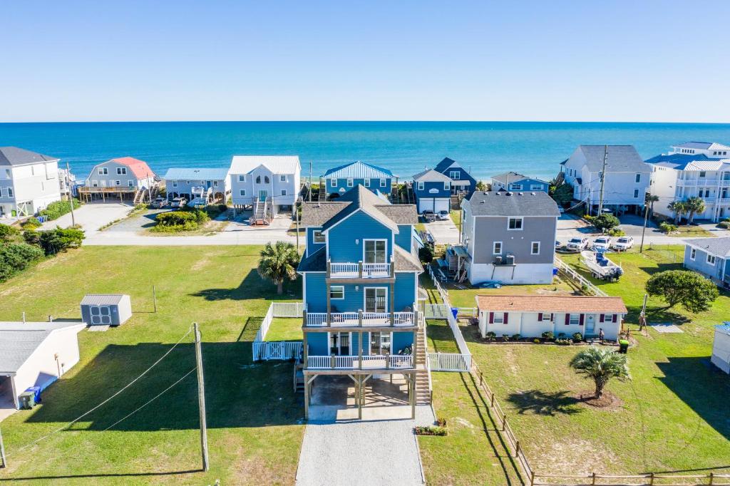 an aerial view of a neighborhood with houses and the ocean at Walk to everything, 360 views, elevator, fence in Surf City