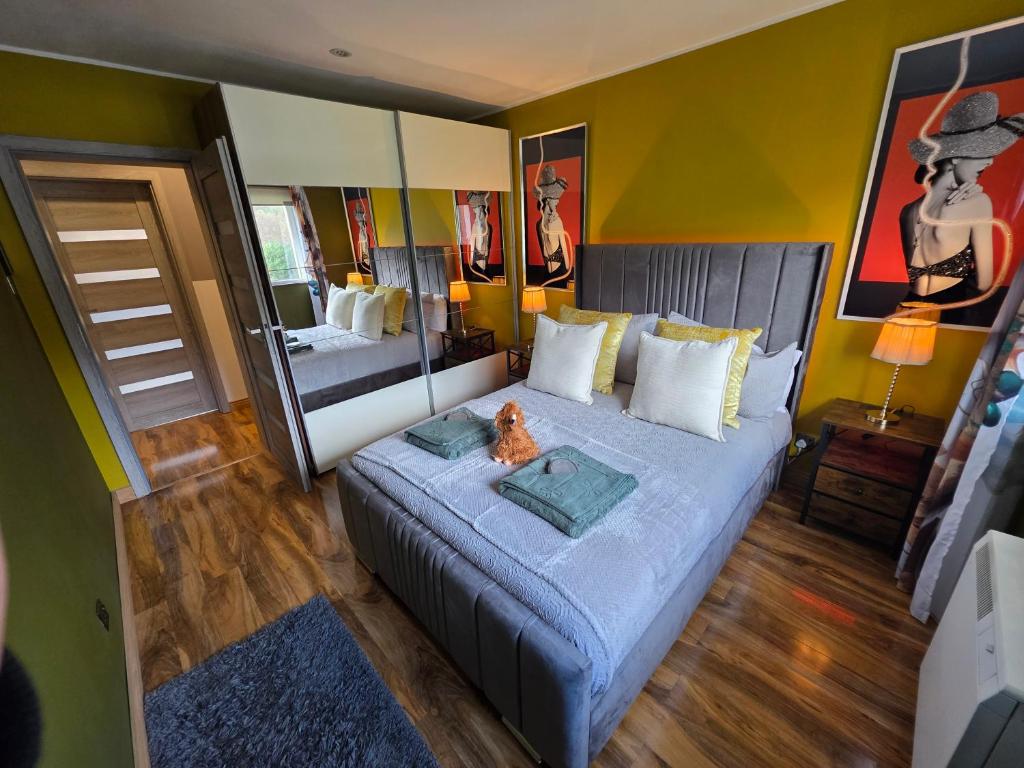 a bedroom with a bed with a cat sitting on it at The Mountain Lake in Fort William