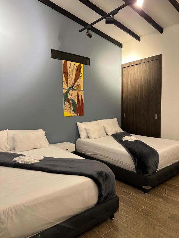 Ένα ή περισσότερα κρεβάτια σε δωμάτιο στο Finca hotel villa del lago