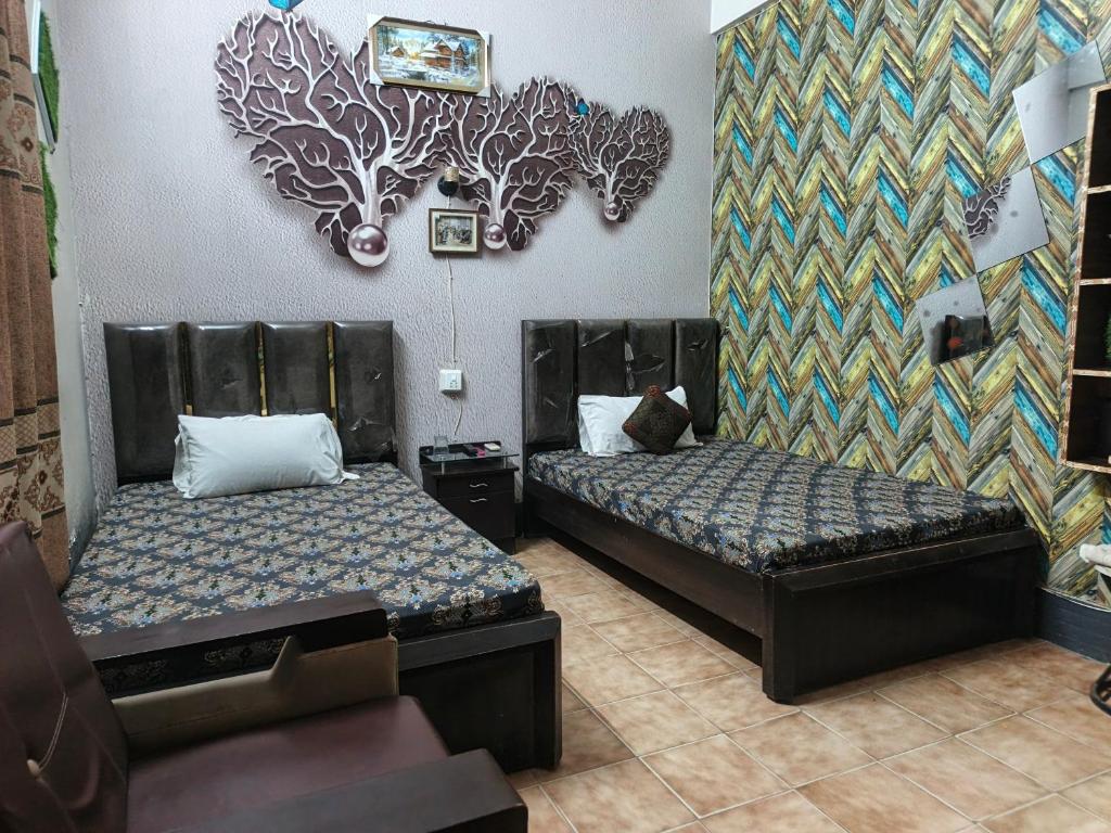 Ένα ή περισσότερα κρεβάτια σε δωμάτιο στο Safari Guest House