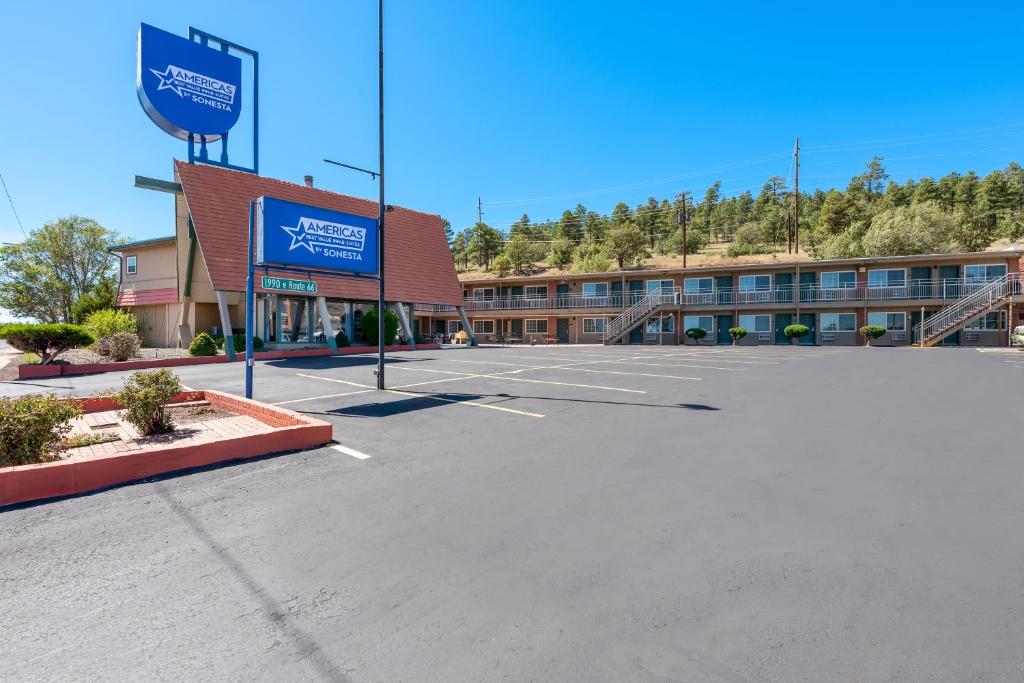an empty parking lot in front of a hotel at Americas Best Value Inn and Suites Flagstaff in Flagstaff