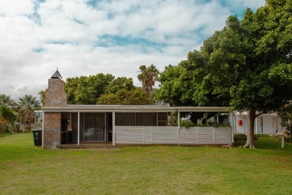 a brick house with a chimney on top of it at The Ocean Side Cottage in Cape Town