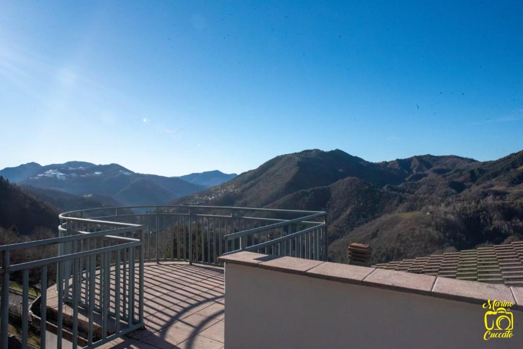a balcony with a view of the mountains at La Casa Del Lupo in Serina