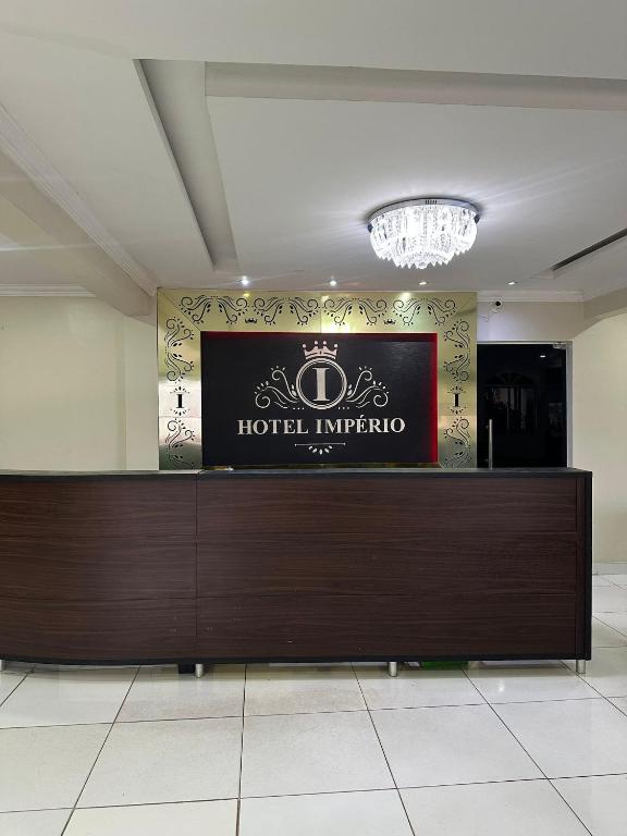 a hotel reception desk in a hotel lobby at Hotel Império Santarém in Santarém