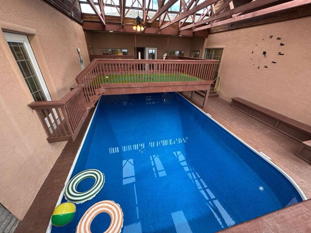 an overhead view of a swimming pool in a building at White Sands NP Retreat in Alamogordo