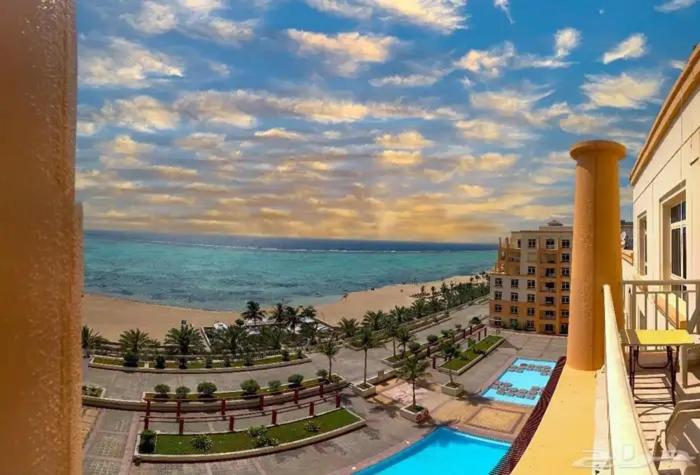 a view of the beach from a balcony of a resort at ريفان بيتش ثلاث غرف عوائل واعمال in King Abdullah Economic City