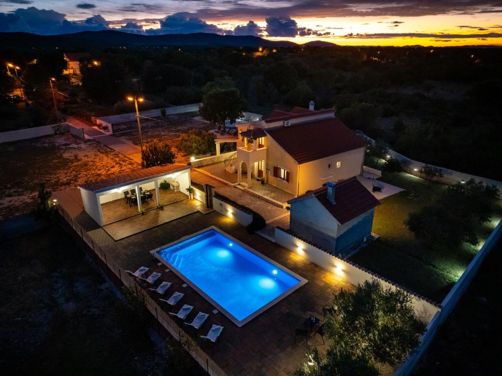 an aerial view of a house with a swimming pool at My Dalmatia - Villa Marijana in Radonić