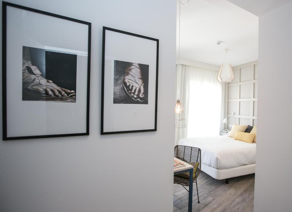 Łóżko lub łóżka w pokoju w obiekcie Hotel Boutique Teatro Romano