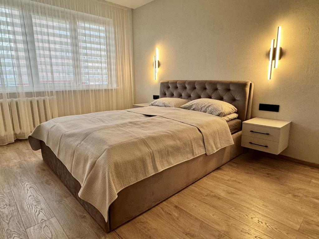 Postel nebo postele na pokoji v ubytování Cozy Baltic Apartment