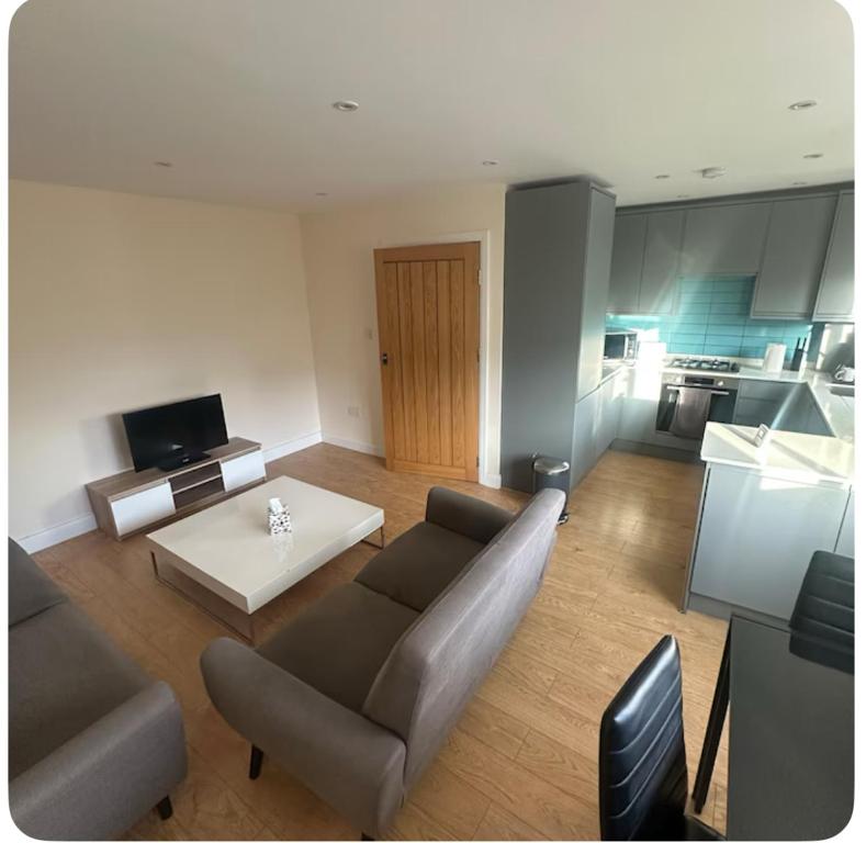 a living room with a couch and a table at 62 Iveagh close in London